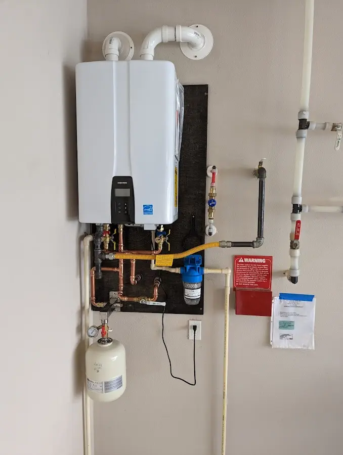 Professional plumber installing copper piping in a Lower Pottsgrove home